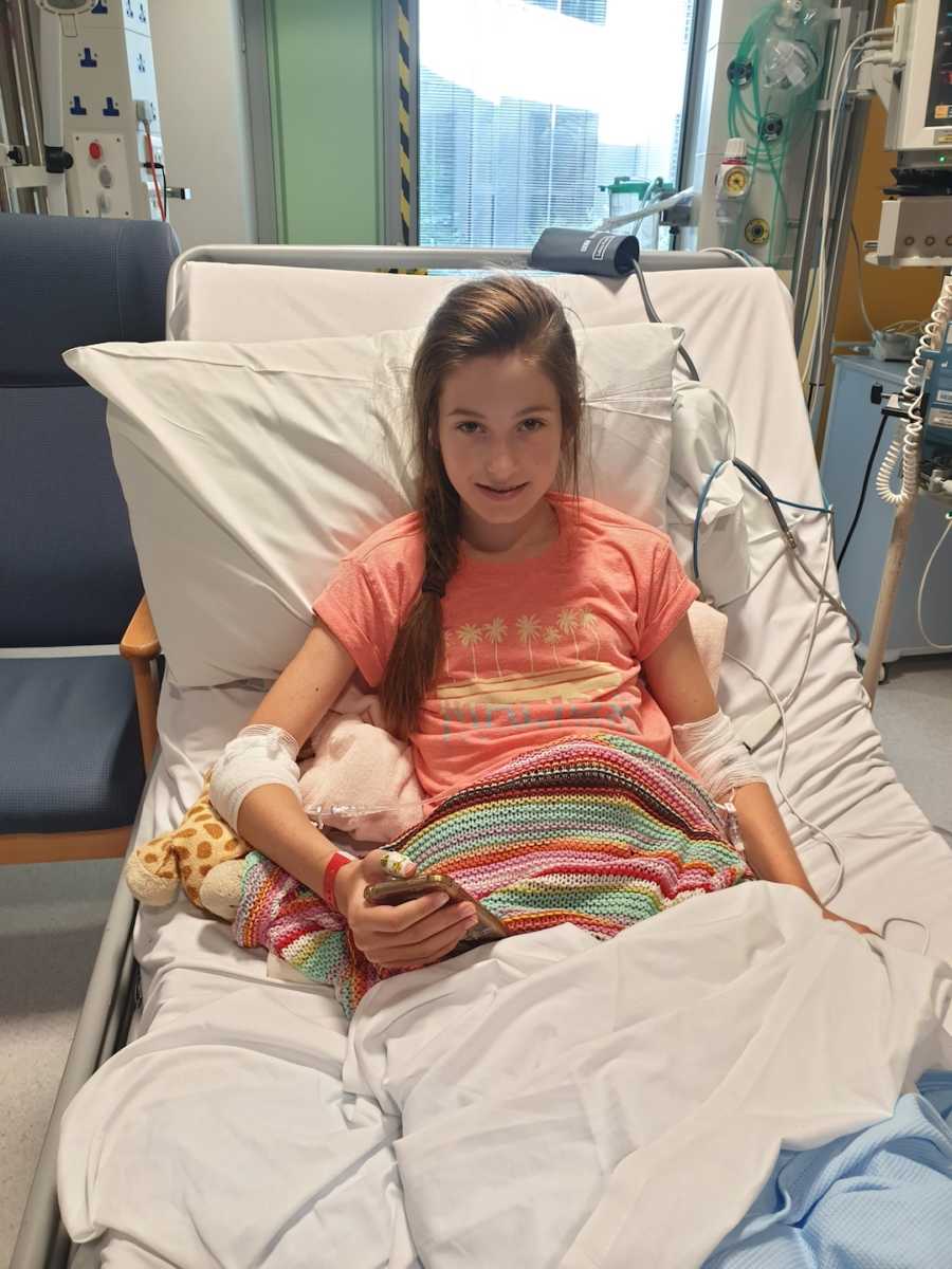 young girl in hospital bed