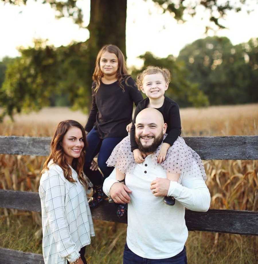 family portrait outside by a tree