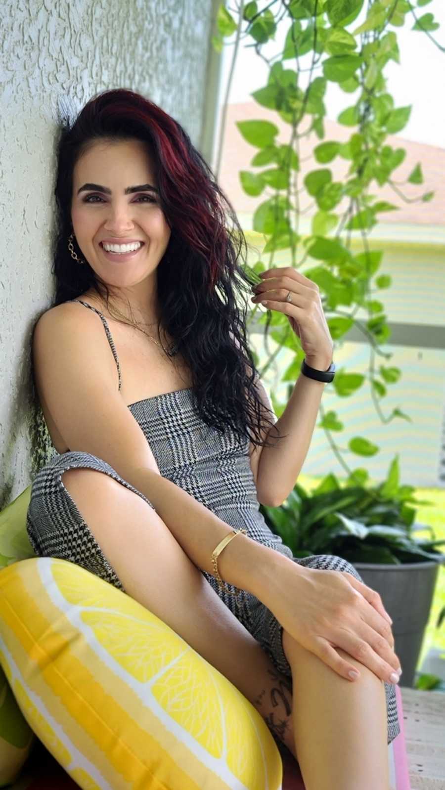 woman in plaid dress smiling