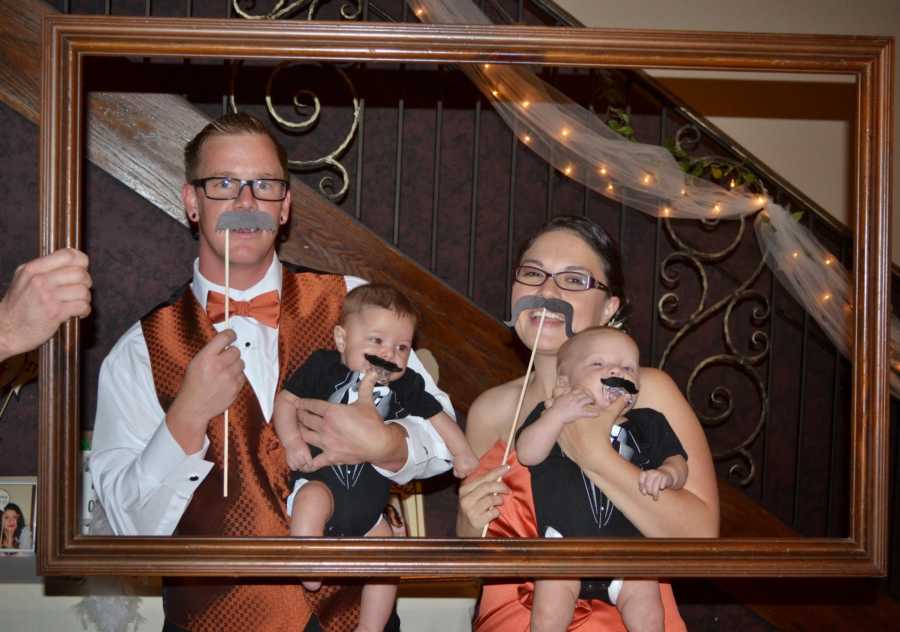 photo of couple and their kids in picture frame