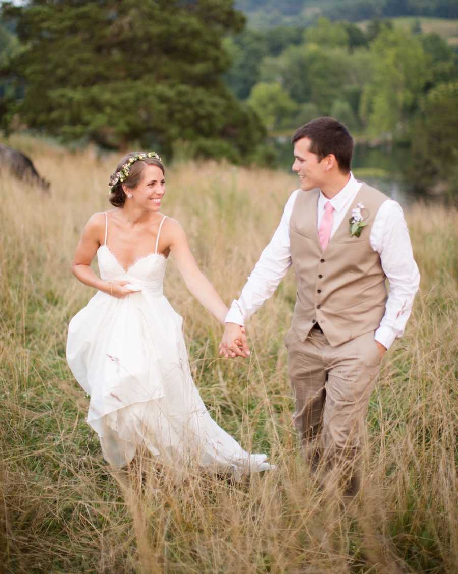 bride and groom in a field