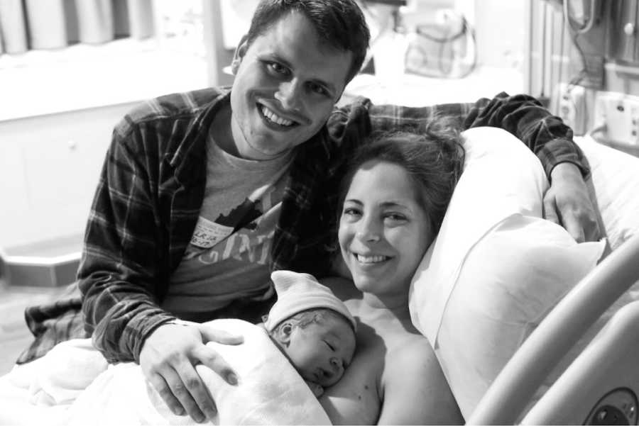 photo of couple with their newborn son