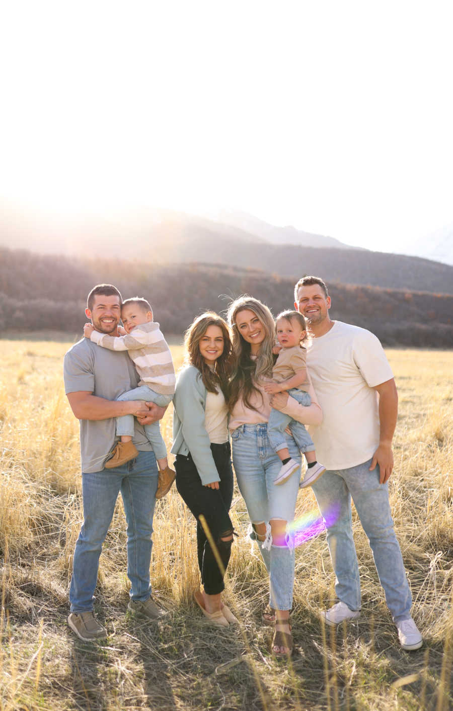 big family photo of two couples and children