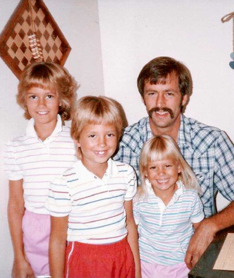 A father and his three young daughters