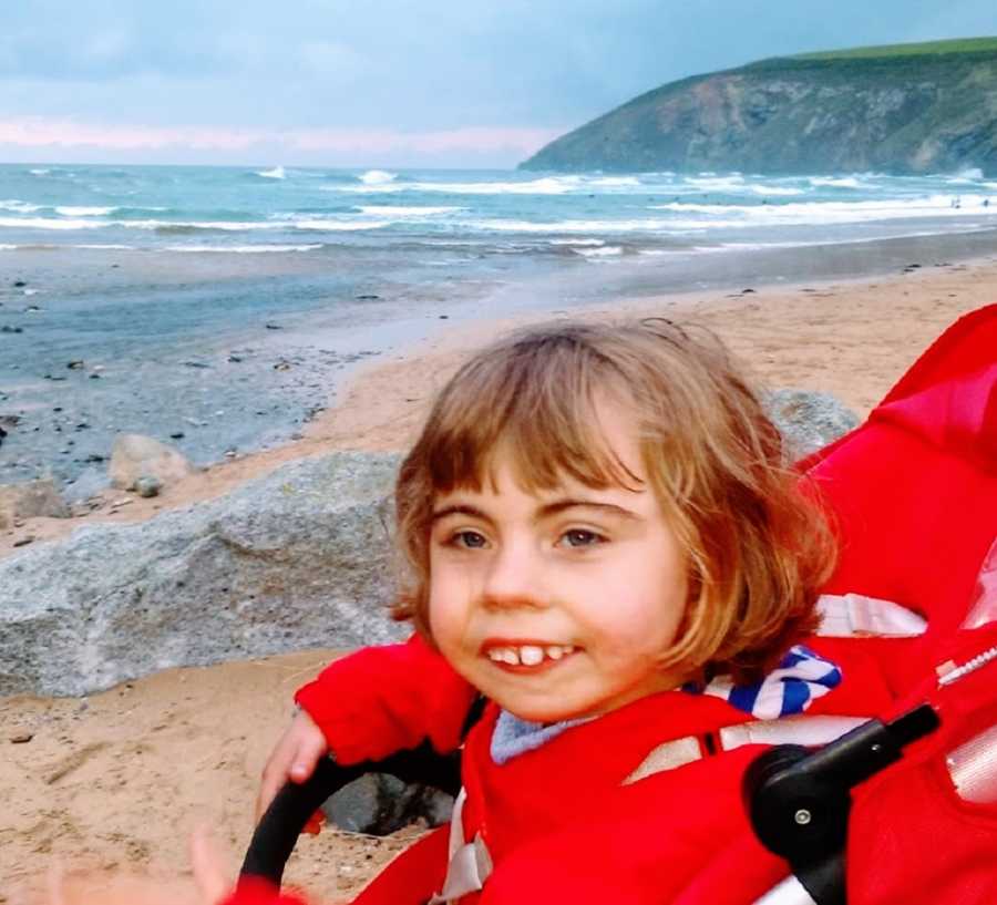 A girl stands at the beach