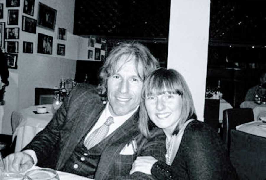 A couple sit together in a restaurant