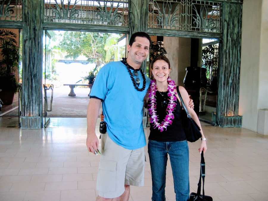 A couple wearing leis on their honeymoon