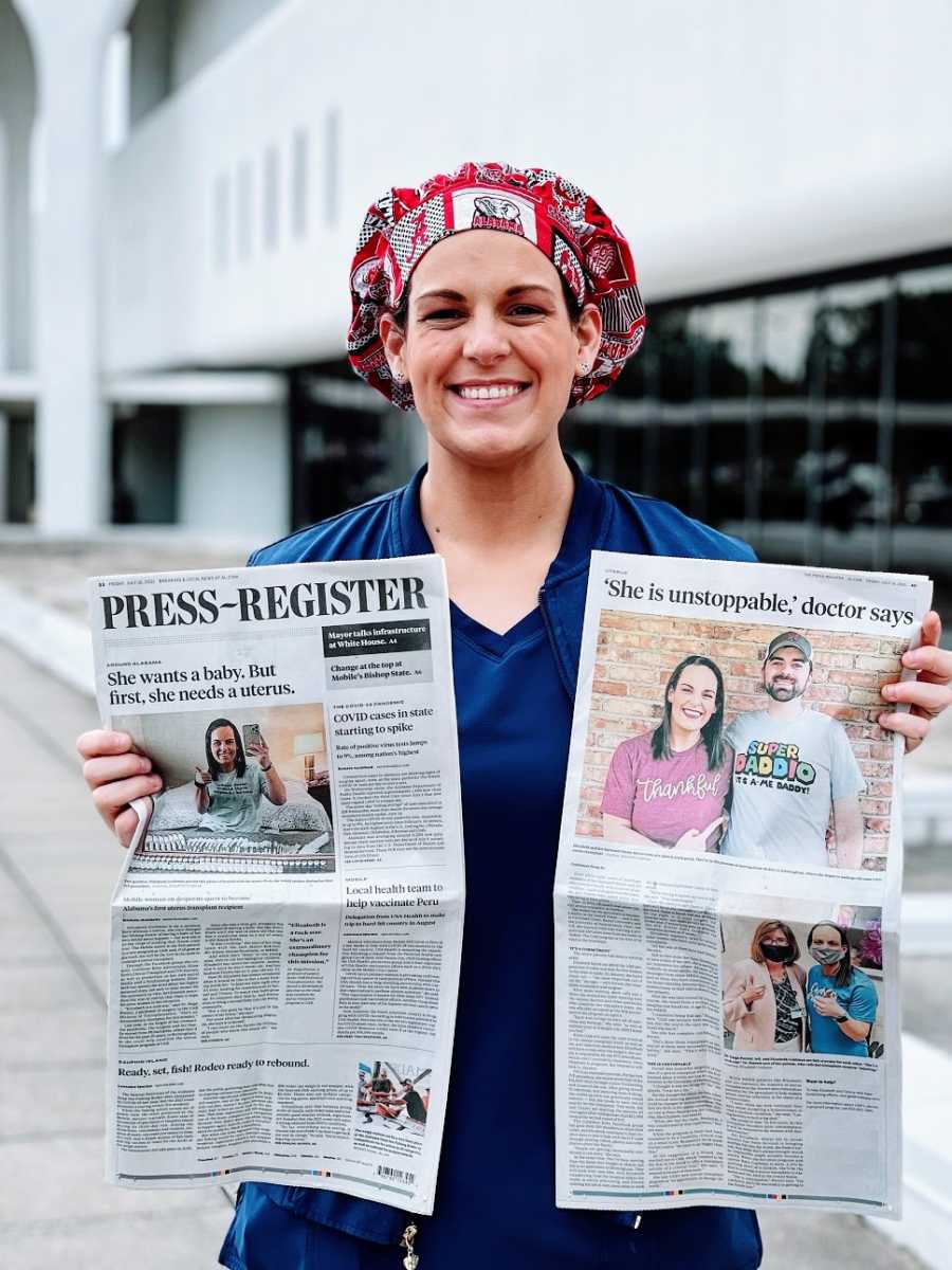 A woman holds up two newspapers featuring her story