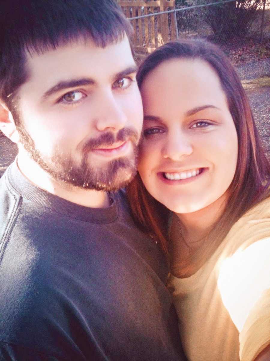 A woman and her husband stand together outside