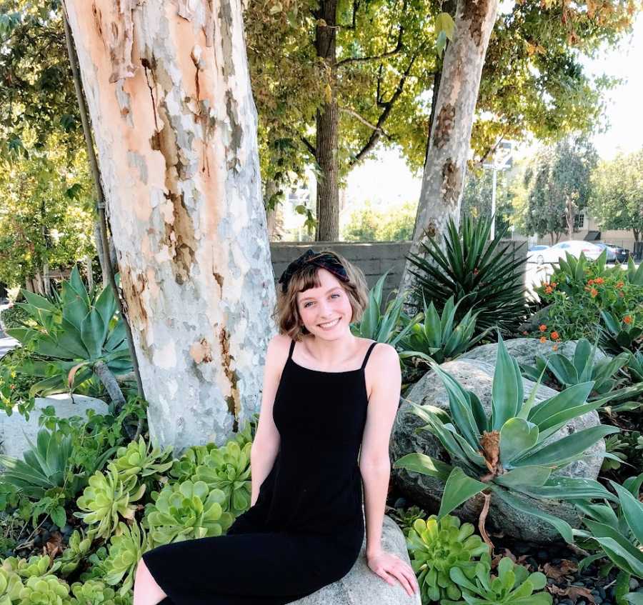 A young woman with autism wearing a black dress