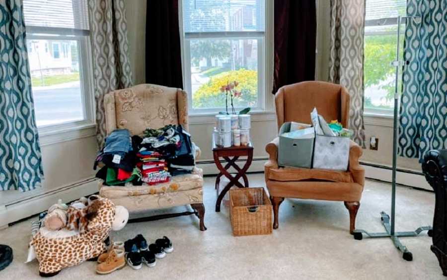 Clothes and toys sitting on chairs for a foster reunification