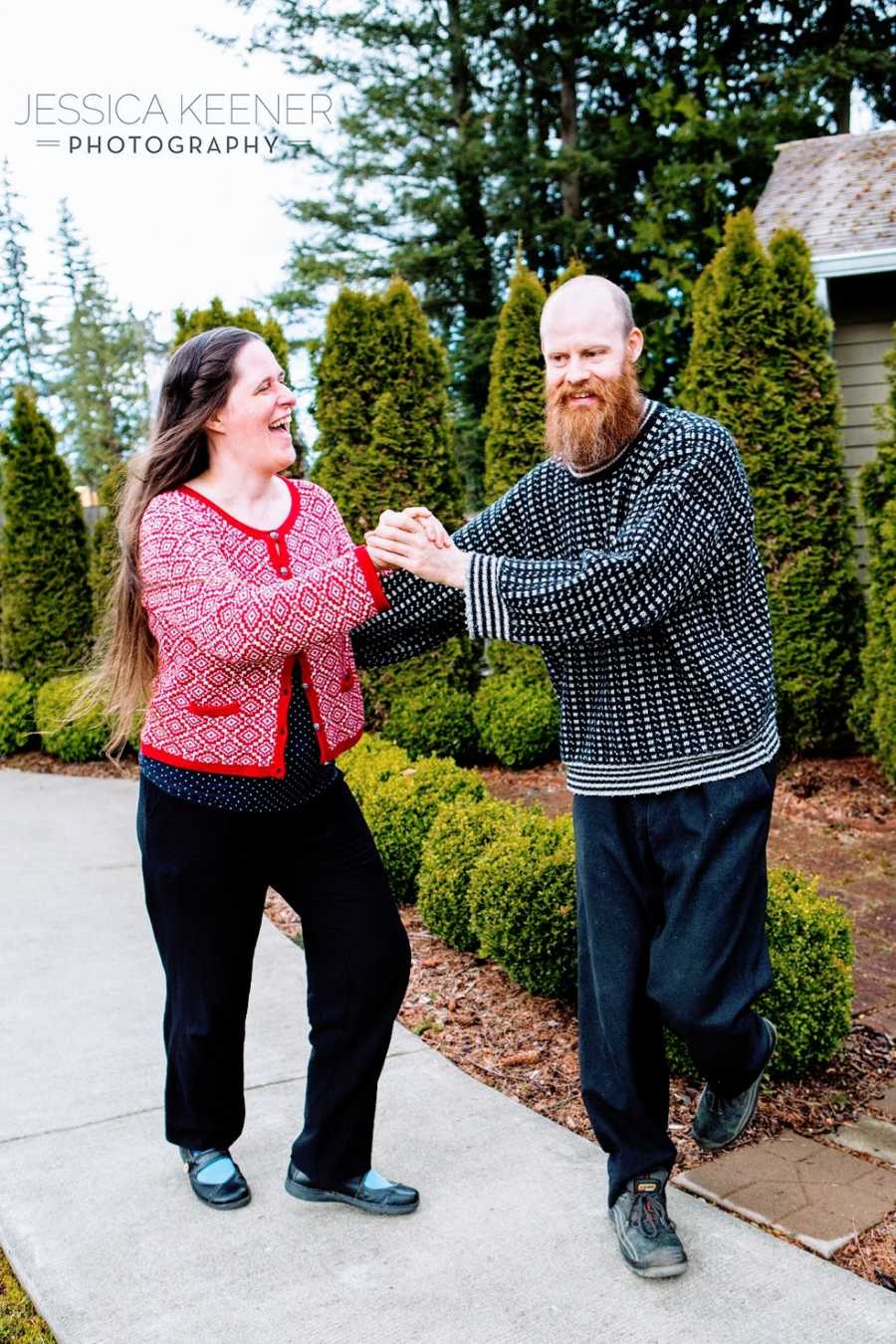 A man and woman dancing on a path