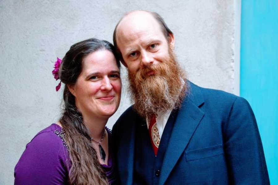 A woman and her husband wearing dressy clothes