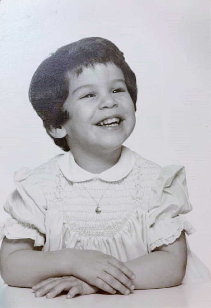 A young girl in a black and white photo