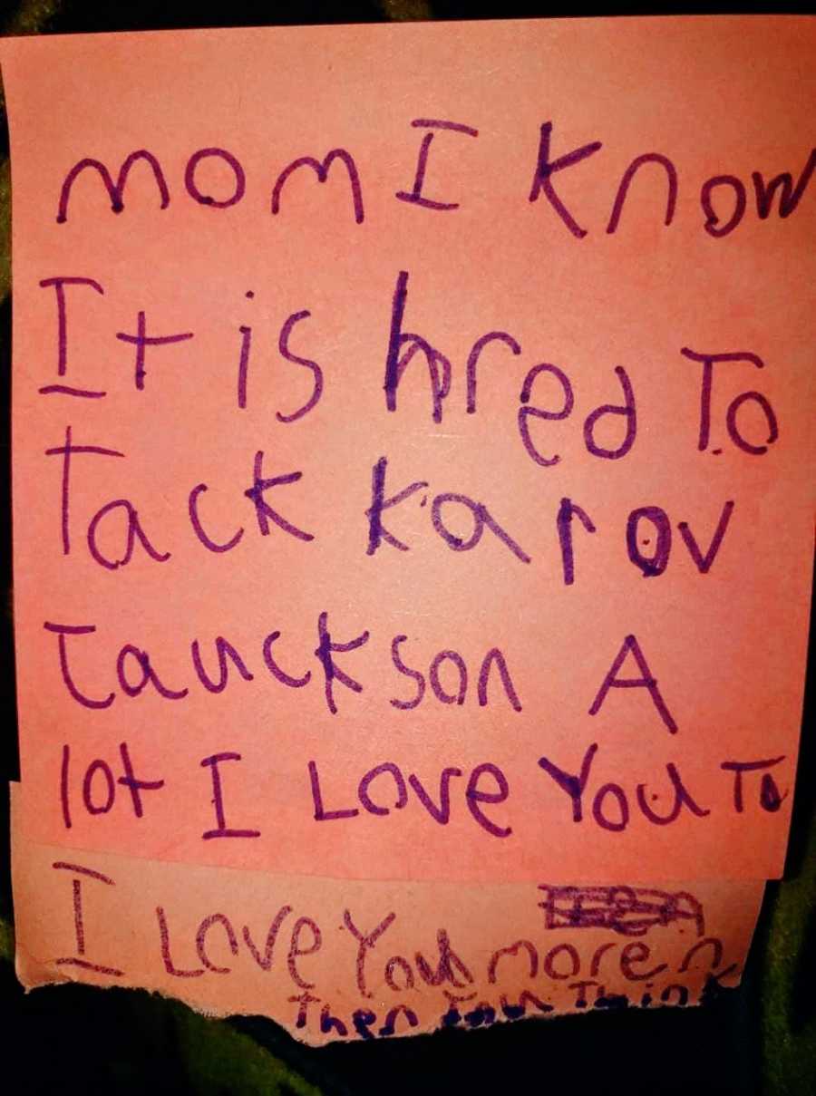 A handwritten note in purple marker from a girl to her mom