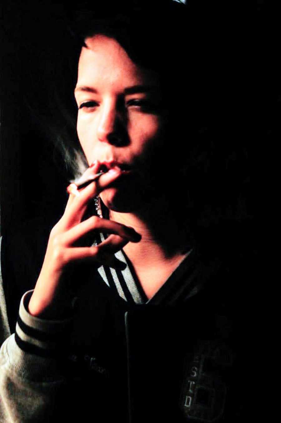 A person smokes a cigarette