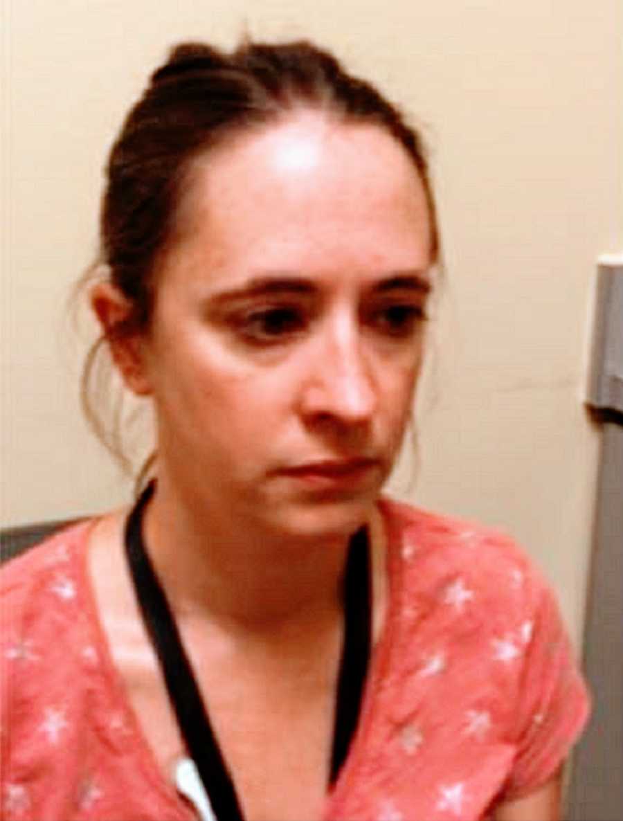 A woman sits in a doctor's office