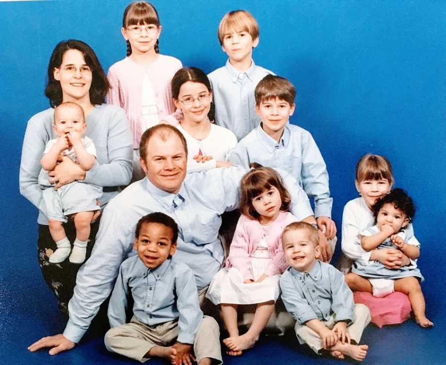 Parents sit with their ten children