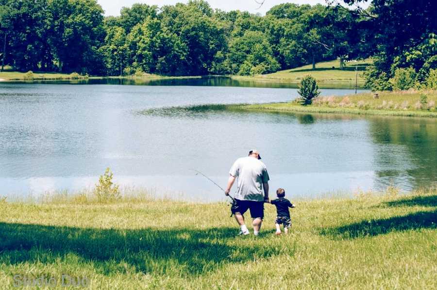 A father takes his son to a lake in the middle of a field