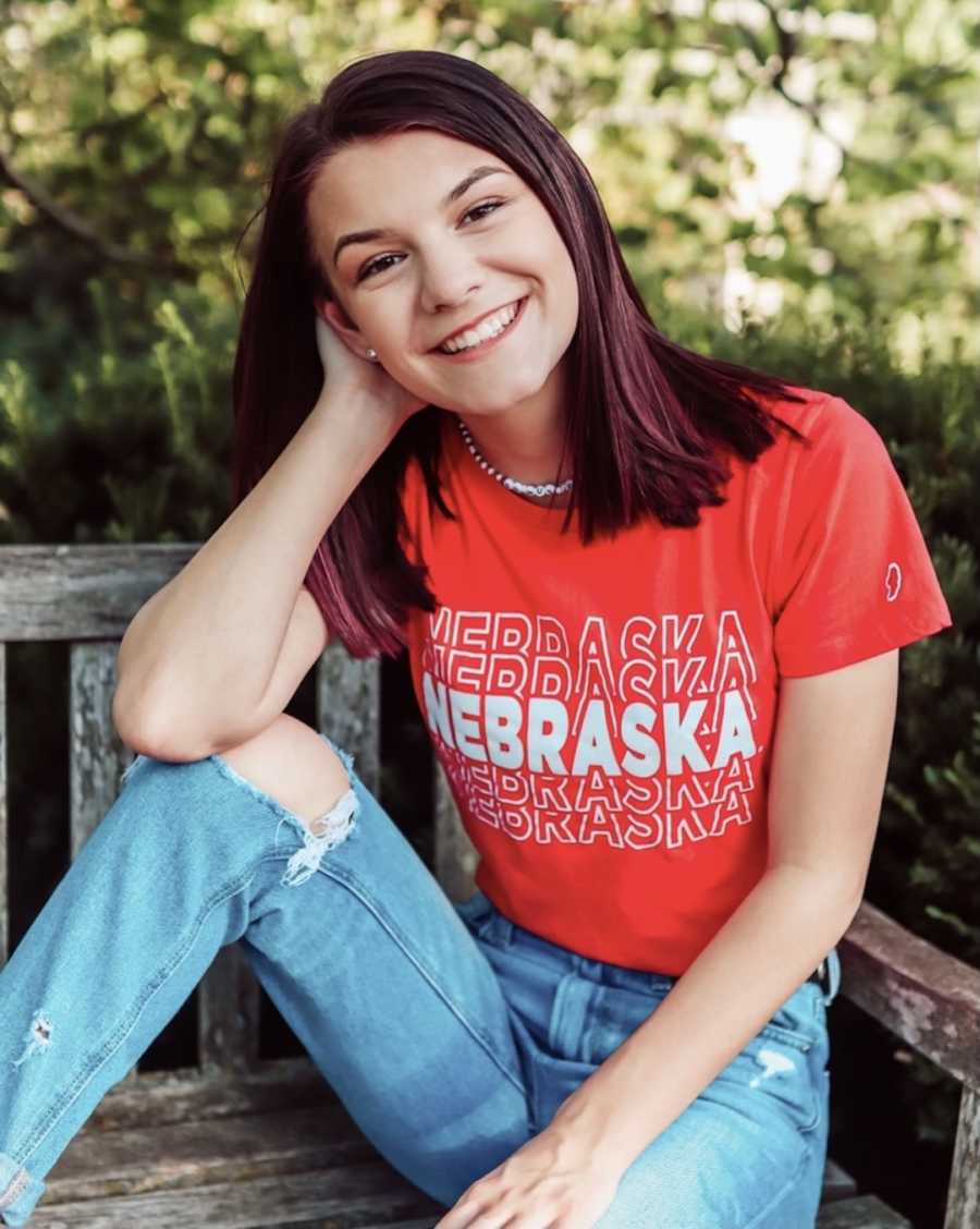 girl with dyed red hair smiling