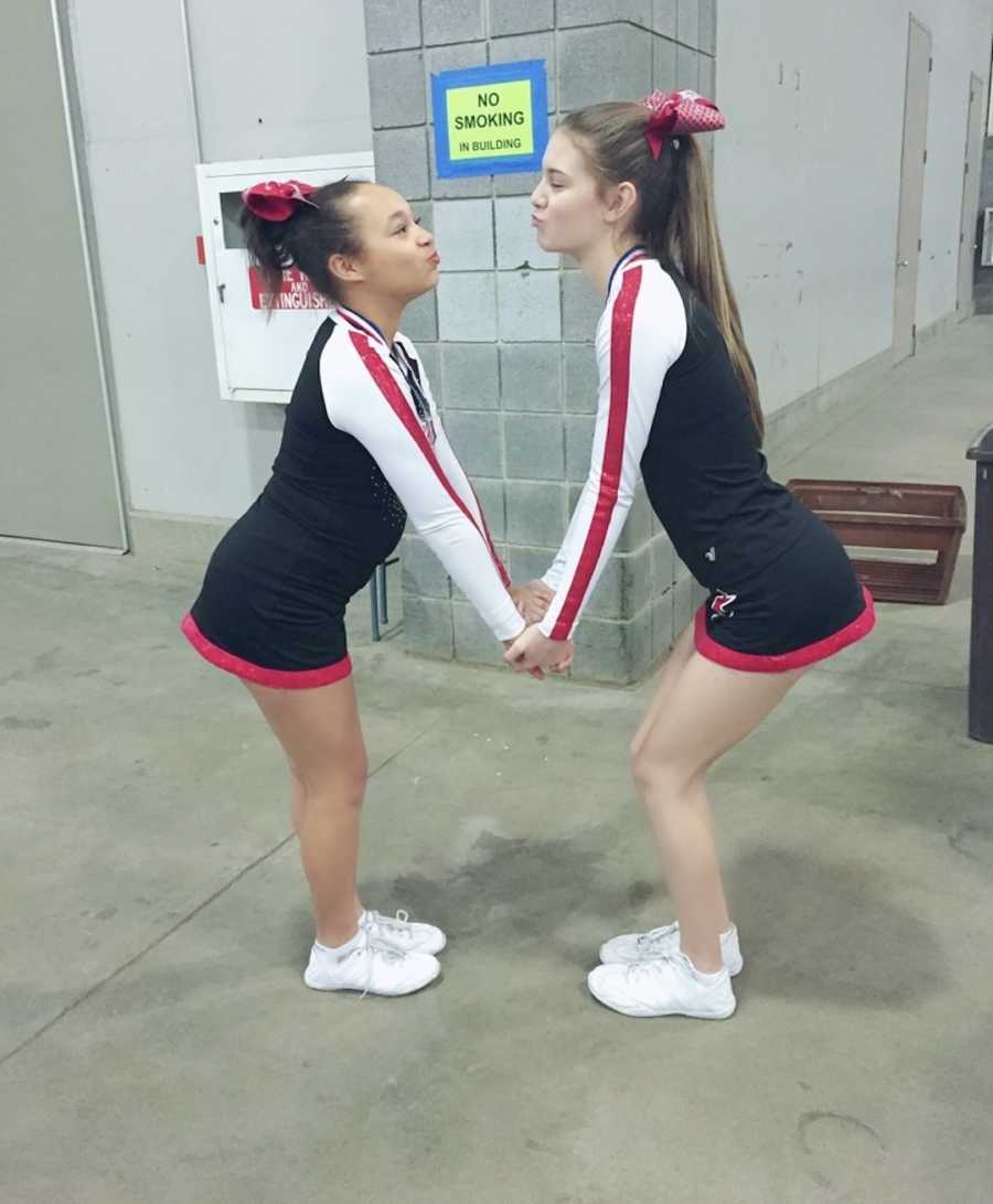 two girls in cheer uniforms