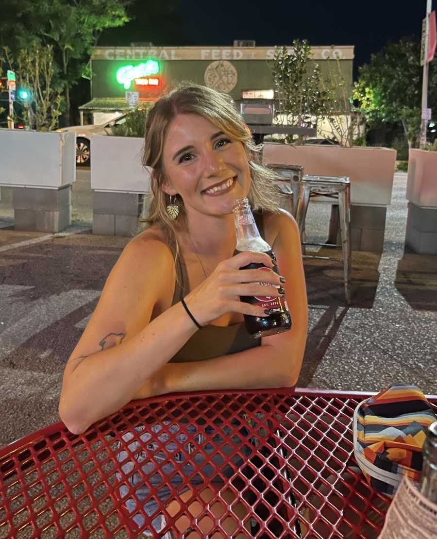 woman holding a beer