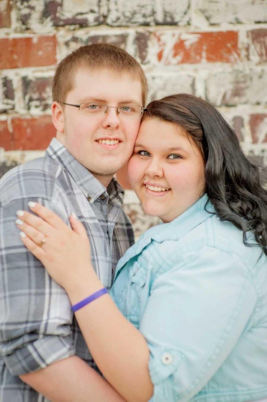 High school sweethearts take couple's photos together, both wearing button-down shirts