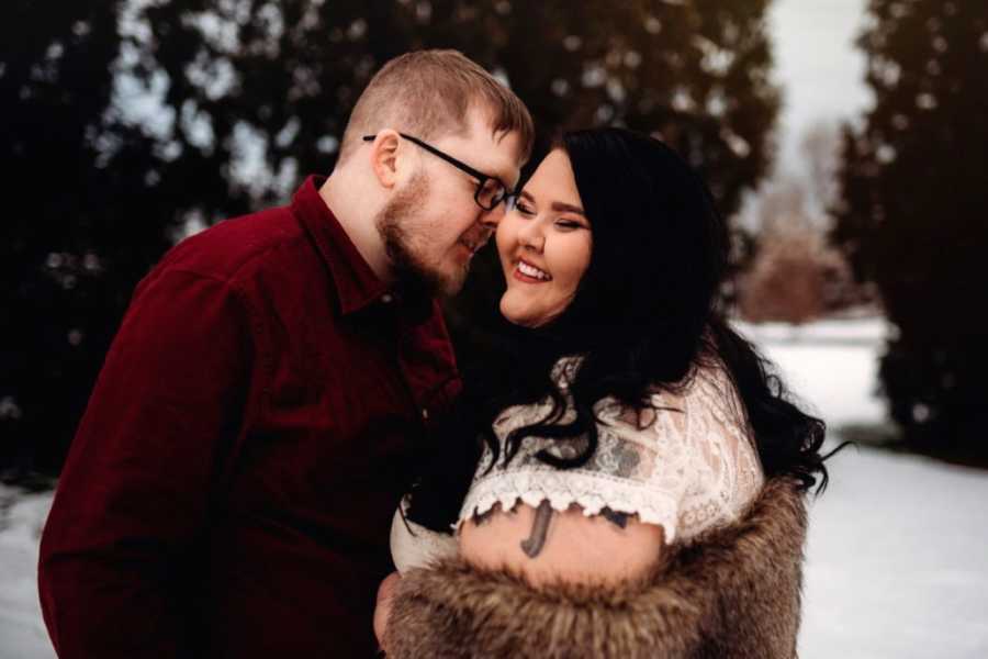 Young married couple take sweet, intimate winter-themed photos in the snow