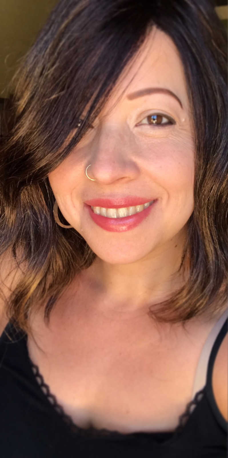 woman with brown hair smiling