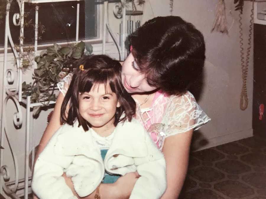 little girl with bangs with her mom