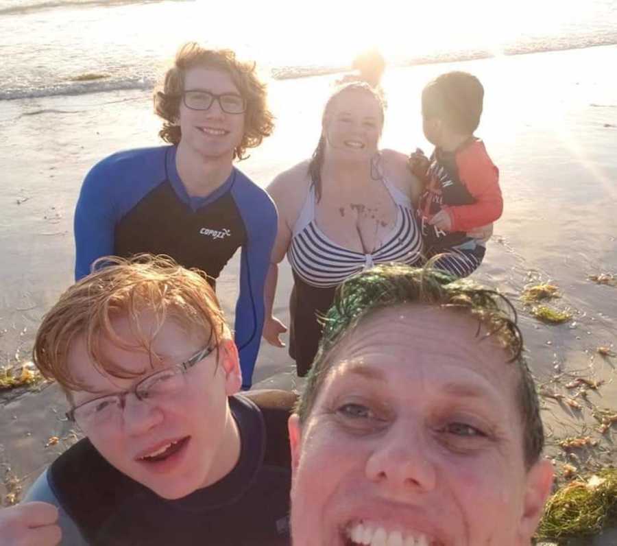 family of 5 on the beach