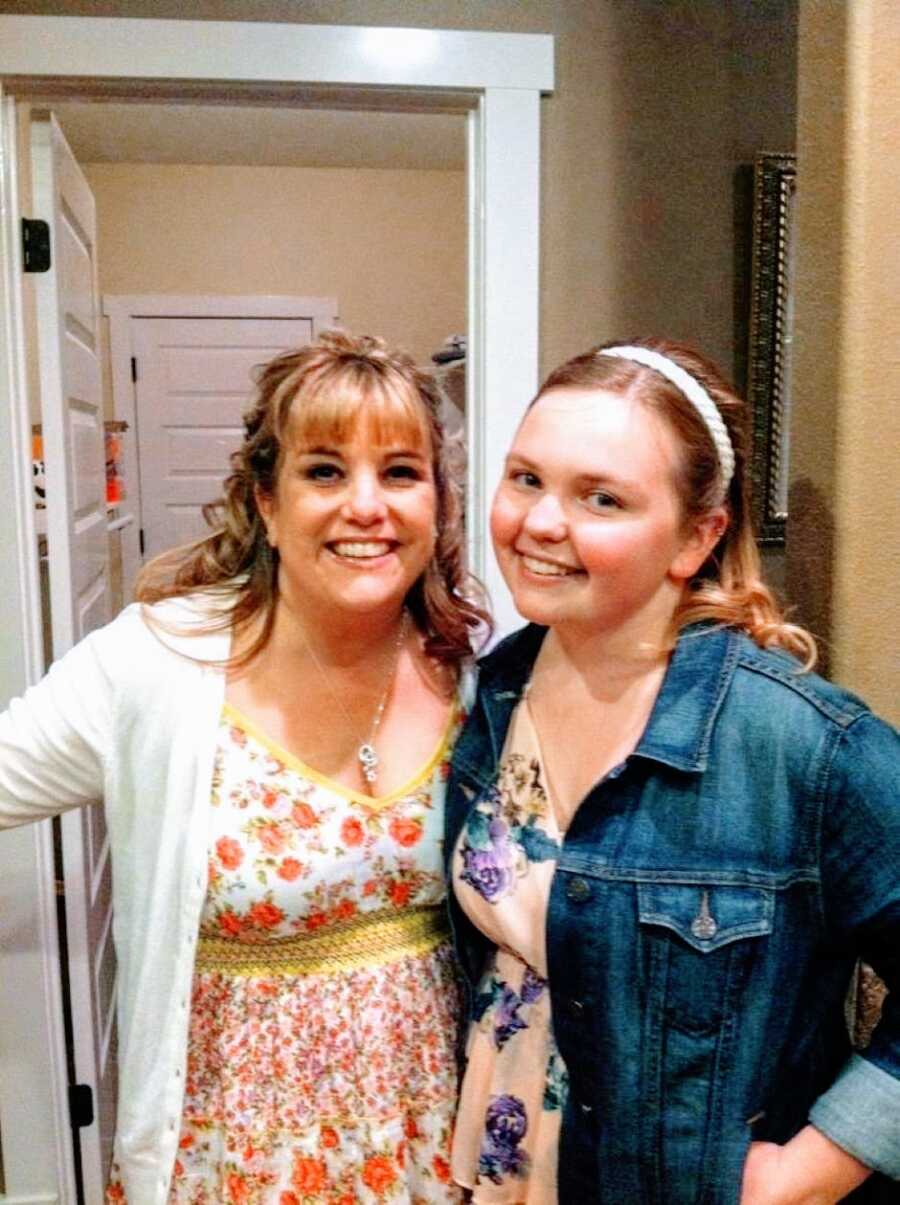 Mom and daughter take a photo together in their Sunday best