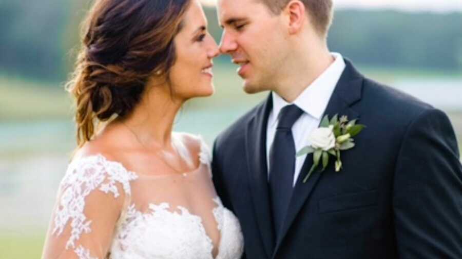 Bride and groom smiling at each other