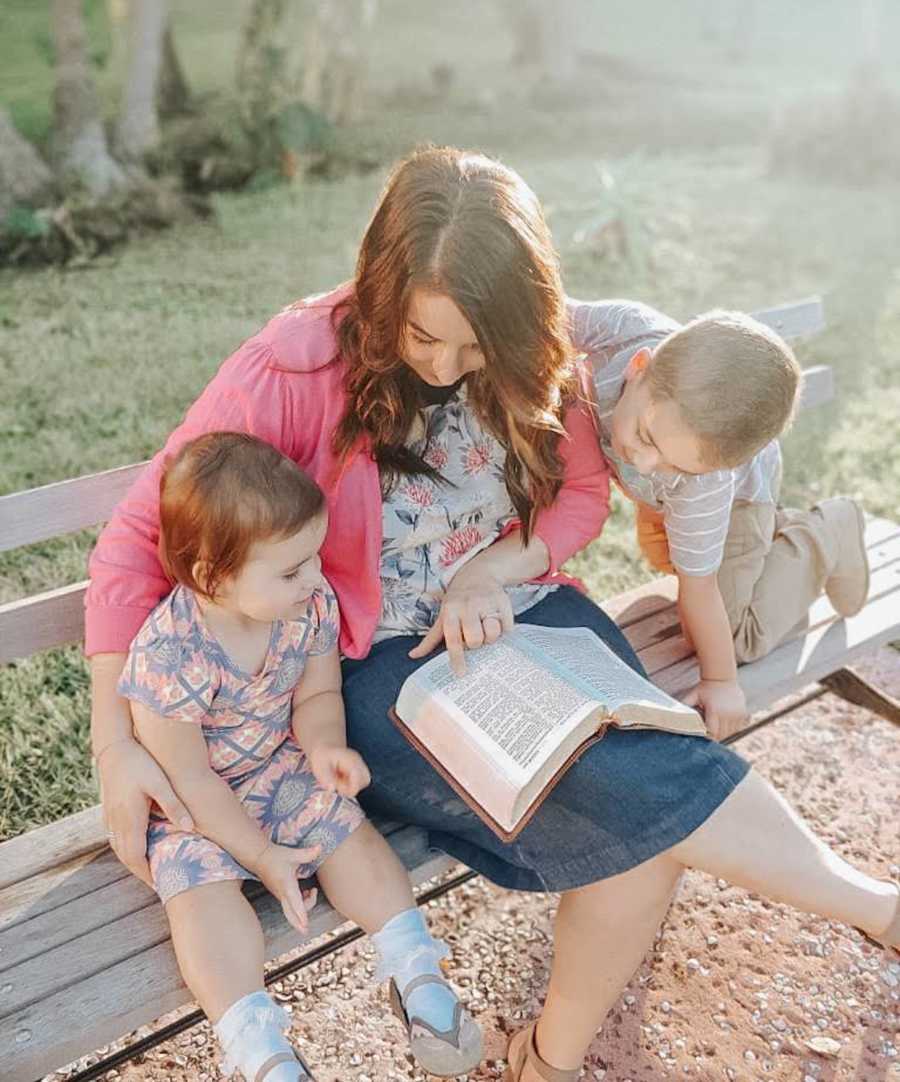 mom reading to her two kids