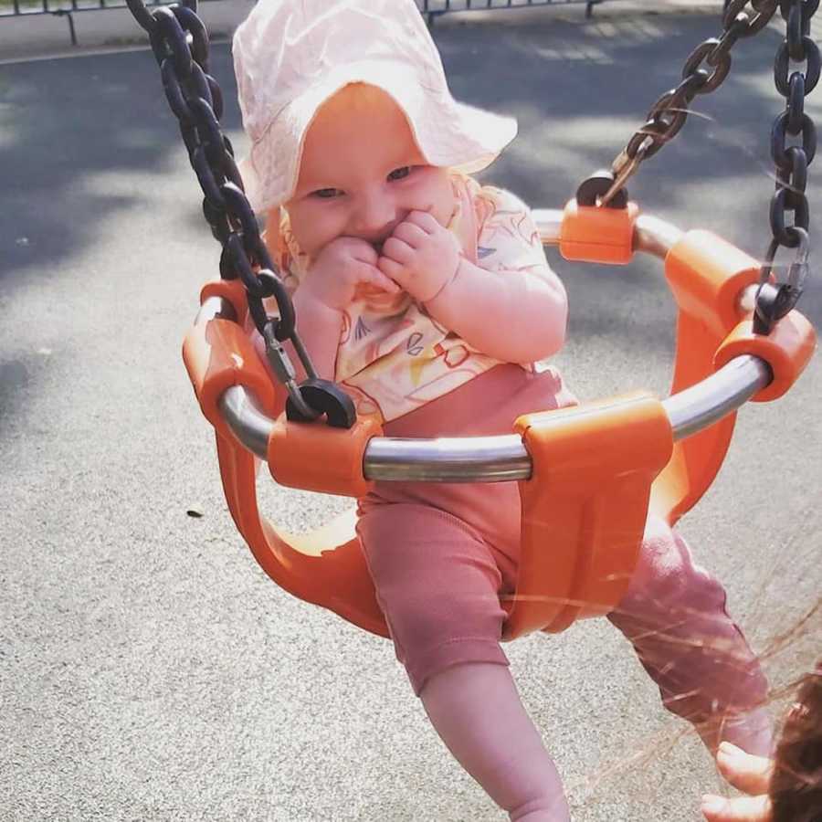 baby girl in a swing