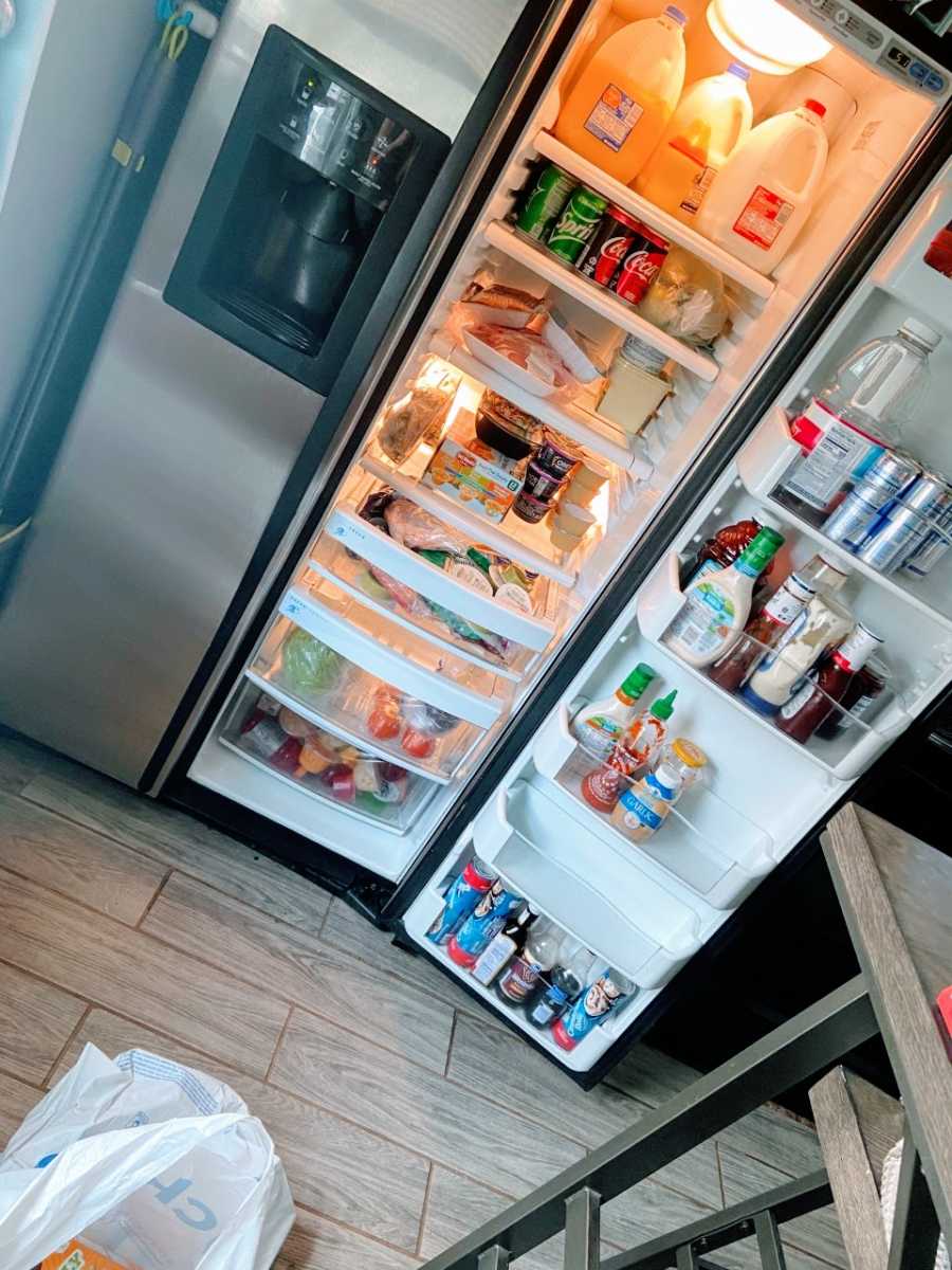 Stay at home mom takes a photo of her stocked up fridge