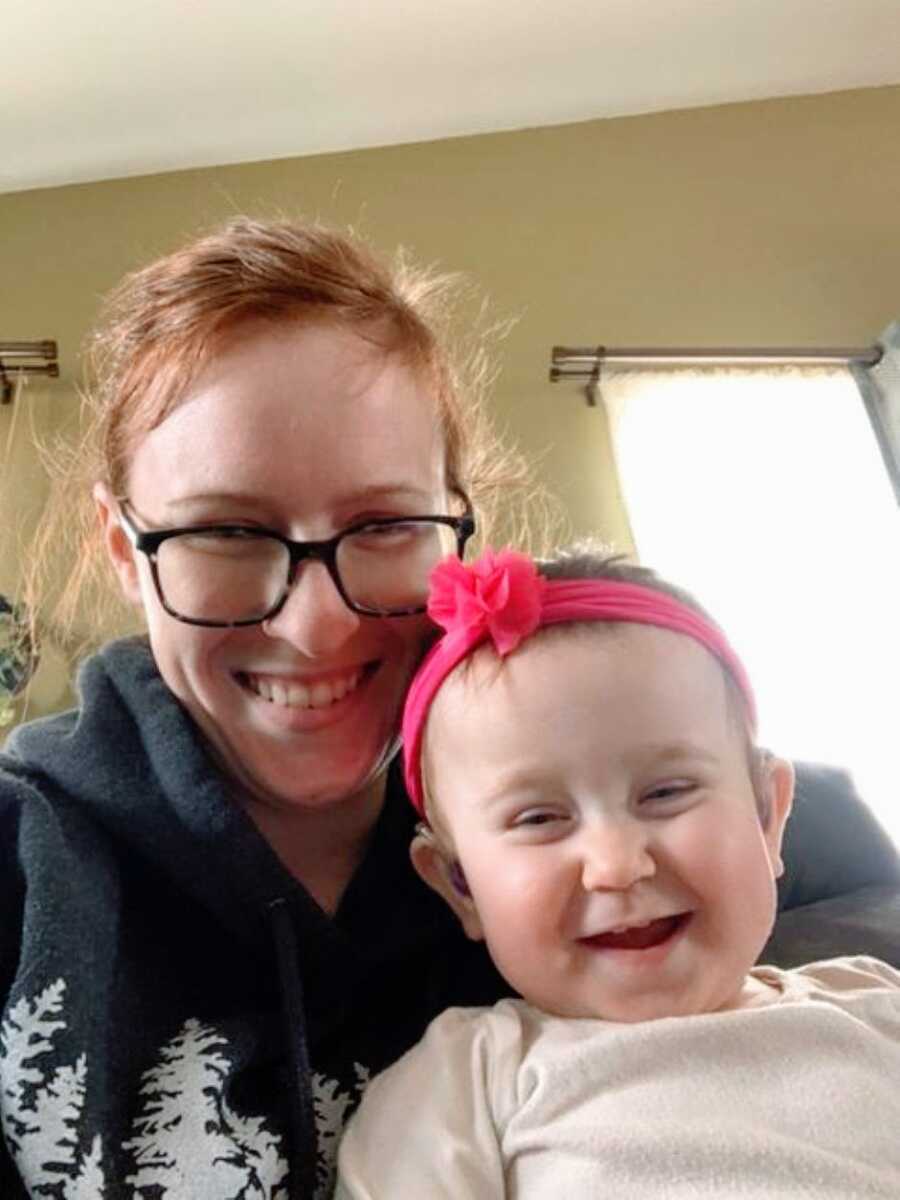 Special needs mom smiles big as she takes a selfie with her daughter born with hydrocephalus and ANSD