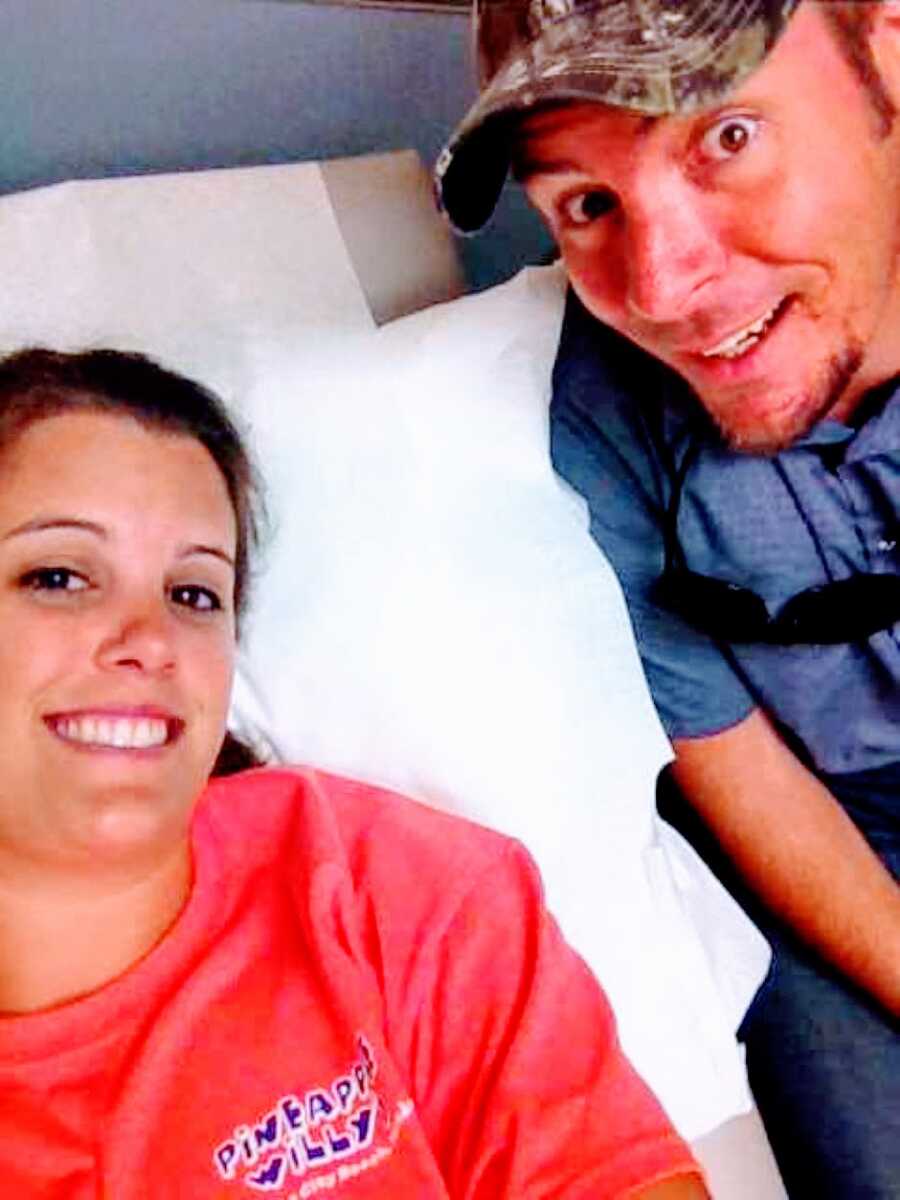 Couple take selfie together while at a fertility specialist getting tests done to figure out why they are struggling with infertility