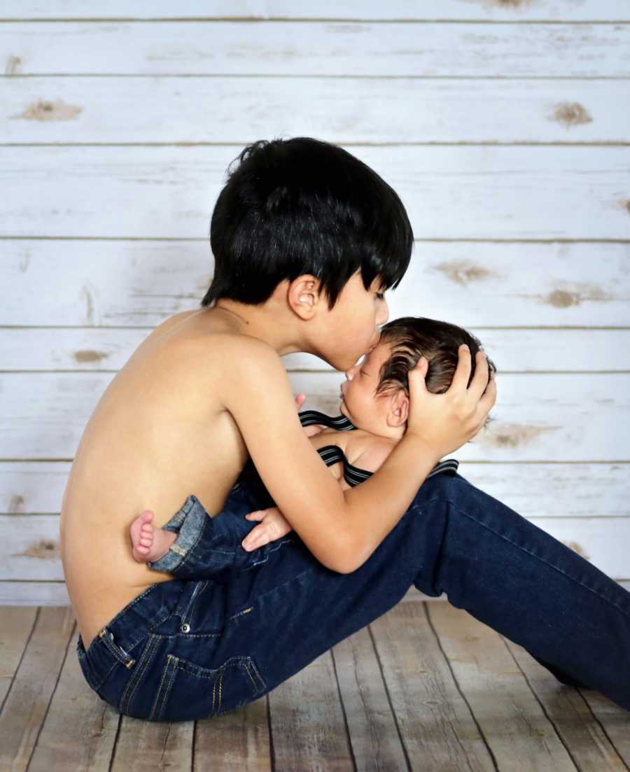 Young special needs brothers share intimate moment during photoshoot