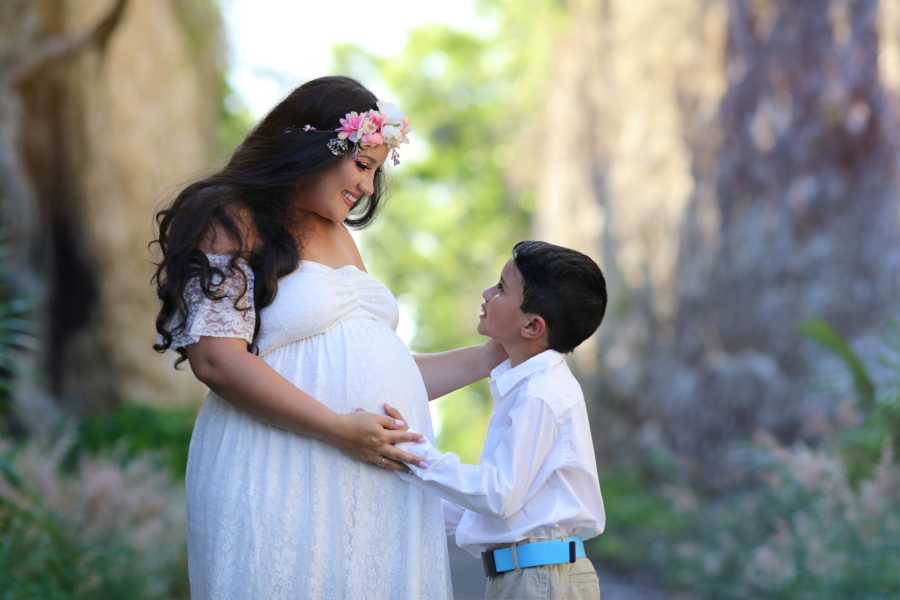 Mom and son share intimate moment during maternity photoshoot as they feel the baby kick