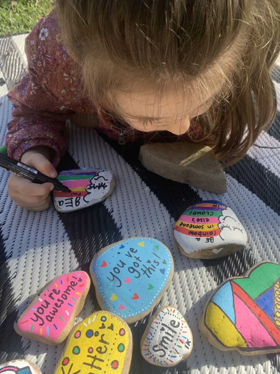 kid making kindness rocks