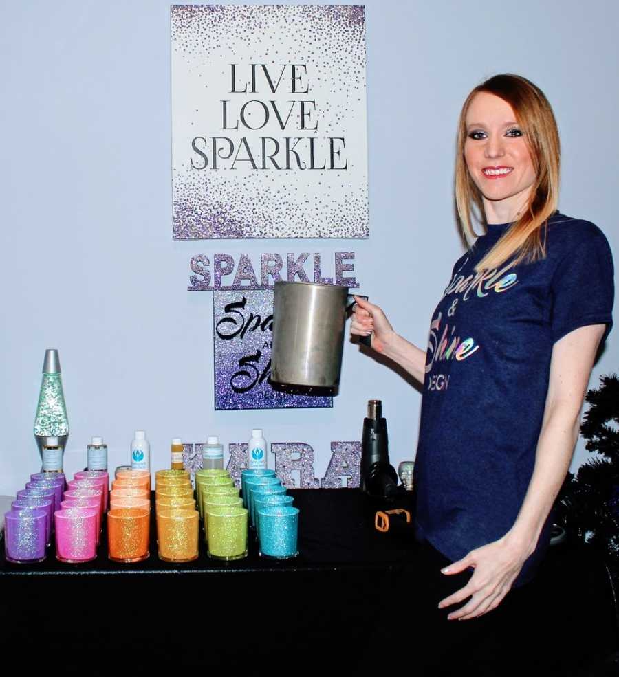 Woman takes a photo with some of her homemade products for her business "Sparkle and Shine"