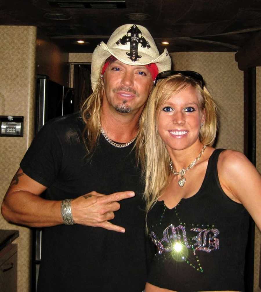 Woman who made hats for Bret Michaels takes a photo with him while he wears one of her hats