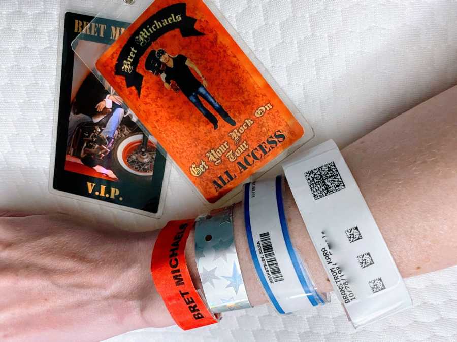 Woman takes photos of V.I.P backstage concert passes for Bret Michaels along with her hospital band