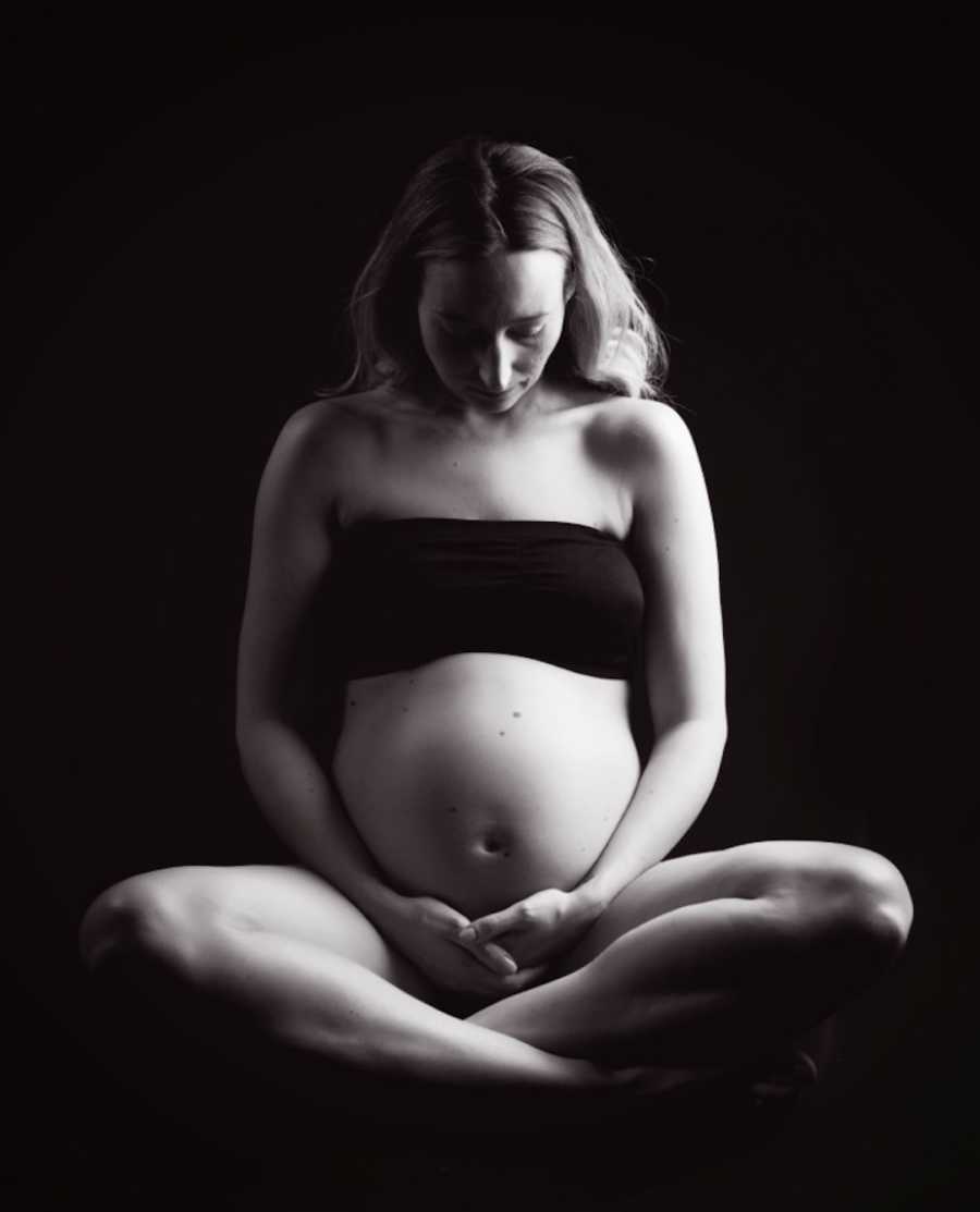 black and white photo of pregnant woman