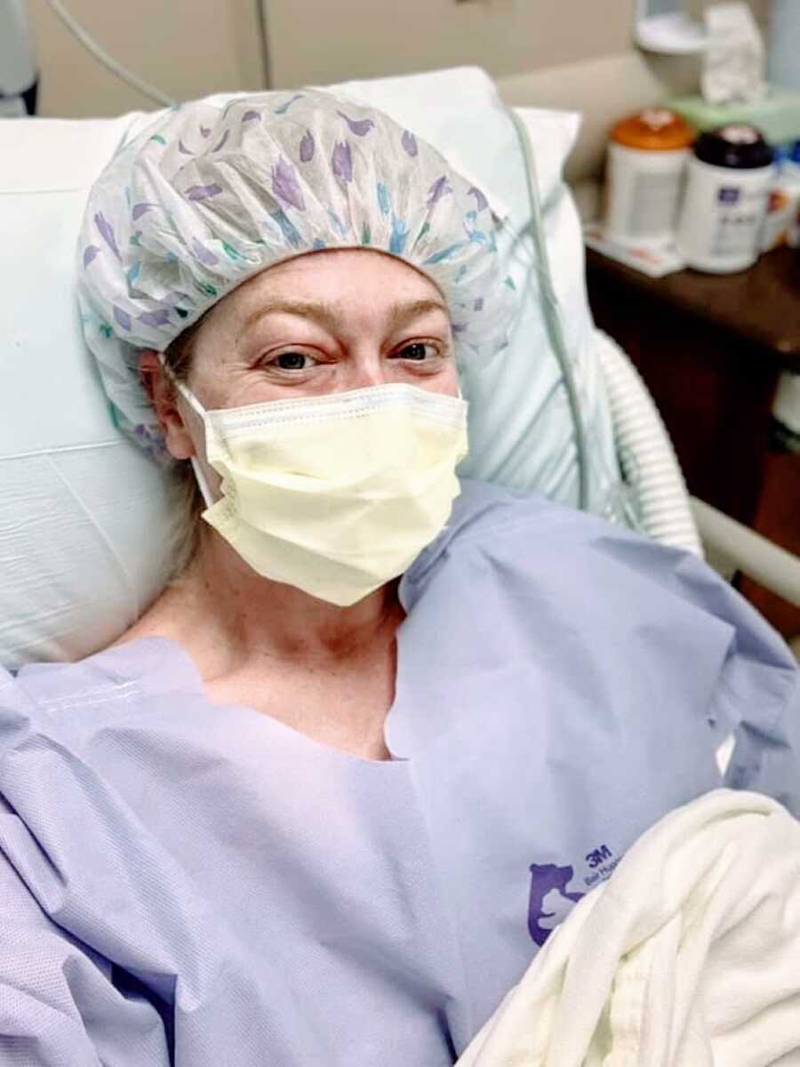 Woman battling lupus and multiple infections takes a selfie in full hospital gear