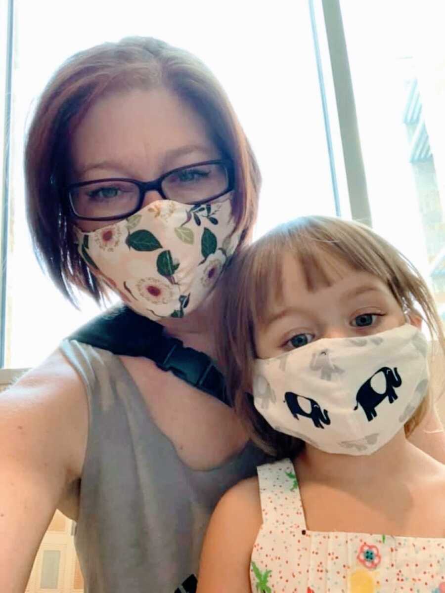 Woman with lupus takes a selfie with her daughter while they both wear masks during the Coronavirus pandemic