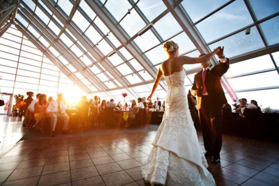 A bride and groom dance at a wedding