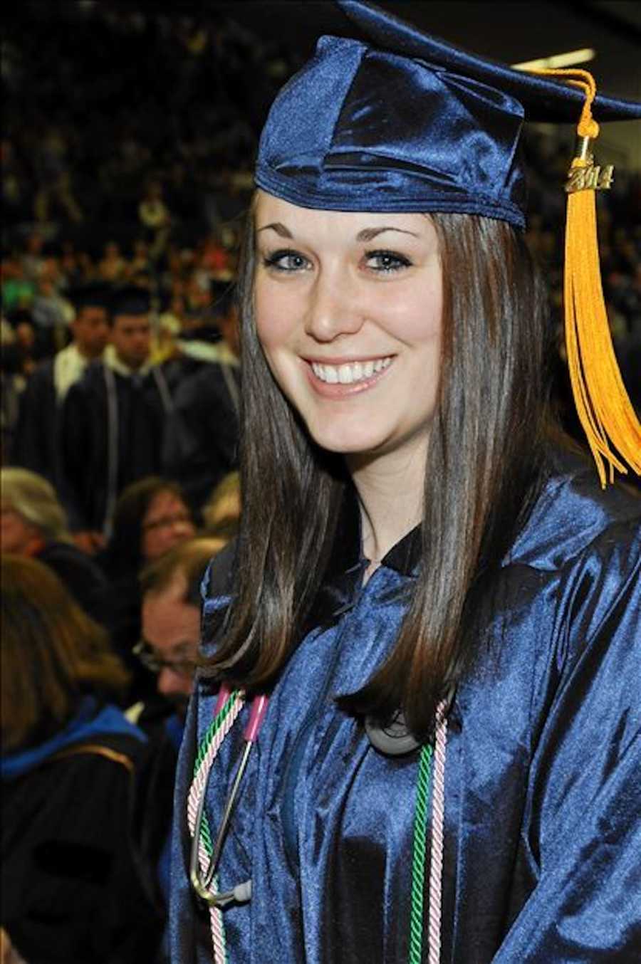 woman in graduation cap and gown