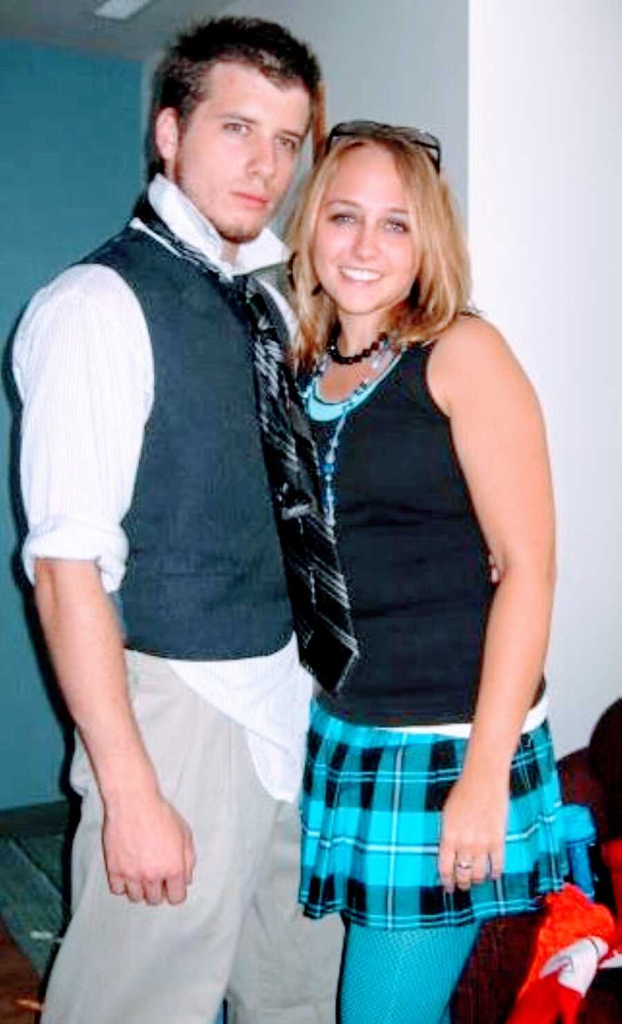 Young college sweethearts take a silly photo together, wearing matching ties